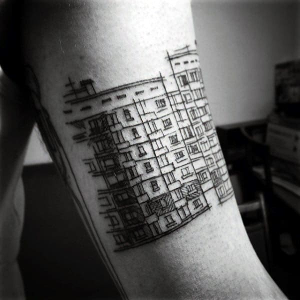 Gentleman With Sketched Building Outline Tattoo On Arm