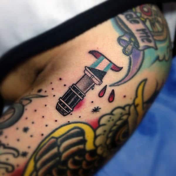 Gentleman With Small Lightsaber Tattoo On Arm