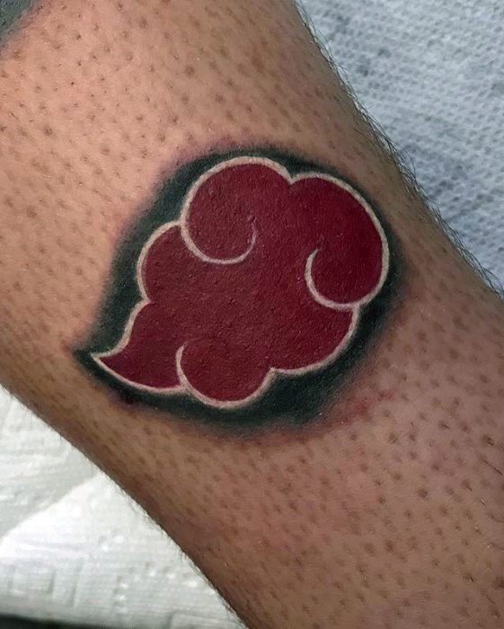 Red cloud tattoo outlined in black with a distinct white border