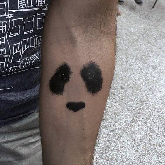 Gentleman With Small Simple Minimalist Panda Eyes And Nose Inner Forearm Tattoo
