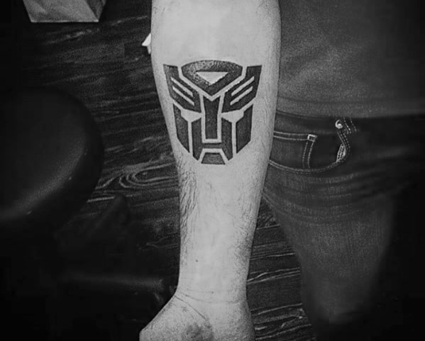 Gentleman With Small Simple Transformers Logo Inner Forearm Tattoo