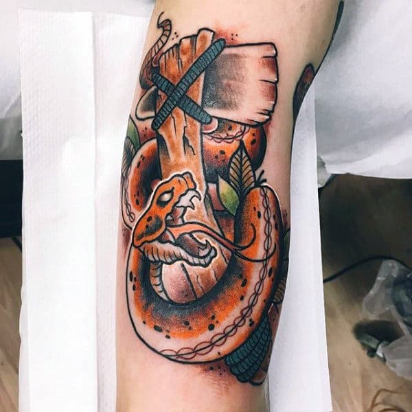Gentleman With Snake Wrapped Around Tomahawk Tattoo On Arm