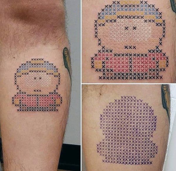 Cross-stitch style Cartman tattoo from South Park, designed with X-shaped patterns for a unique embroidered effect on the skin.
