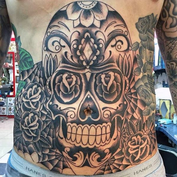 Gentleman With Sugar Skull Tattoos On Stomach