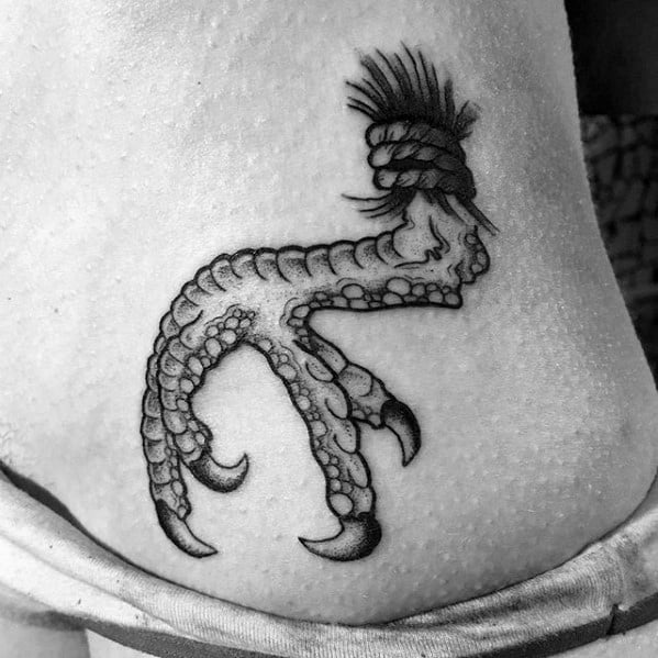 Gentleman With Talon Tattoo On Rib Cage Side Of Body