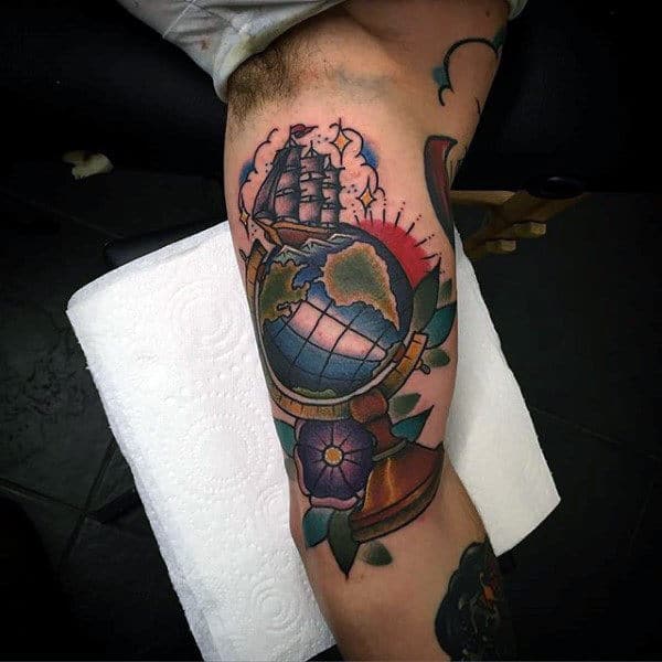 Gentleman With Tattoo Of Sailing Ship And Globe On Arm