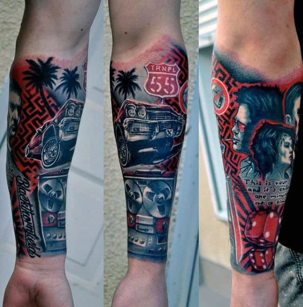 Close-up of a colorful forearm tattoo featuring various artistic designs and symbols
