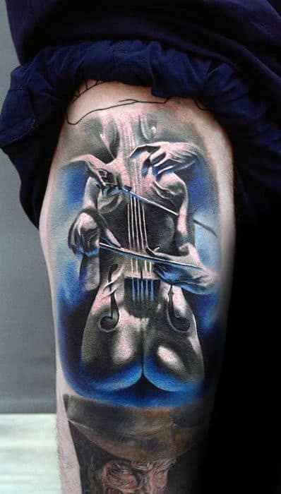 Vivid thigh tattoo of a surreal violin formed from a human body, with blue background accents and dramatic highlights for a striking visual effect.