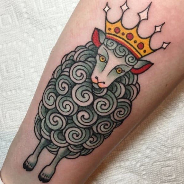 Whimsical tattoo of a crowned sheep with spiral-patterned wool and bright eyes, inked in a bold traditional style.