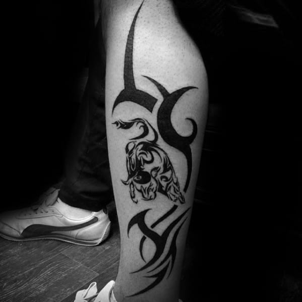 Gentleman With Traditional Tribal Bull Leg Tattoo