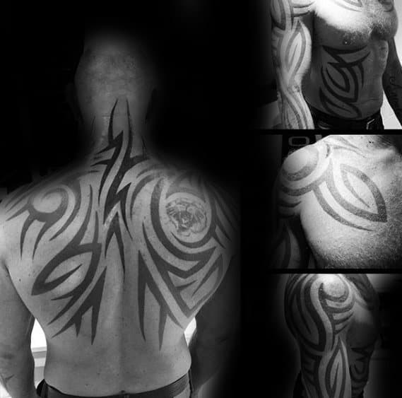 Gentleman With Tribal Back And Neck Tattoo