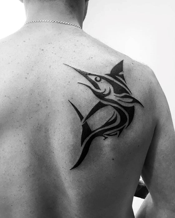 Gentleman With Tribal Black Ink Swordfish Tattoo On Shoulder Blade Of Back