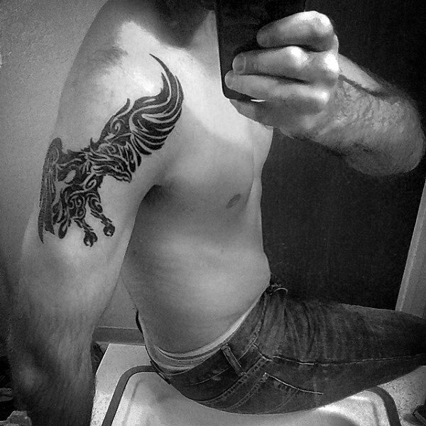 Gentleman With Tribal Eagle Arm Tattoo