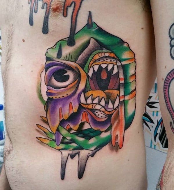 Colorful surreal rib tattoo with melting paint effect, featuring a distorted face with a wide eye and screaming mouth.