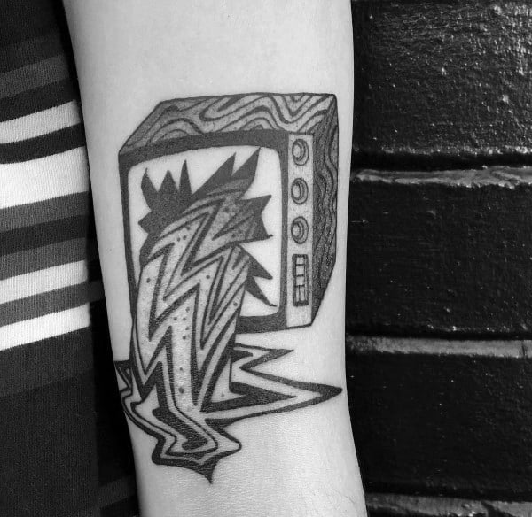 Black ink tattoo of a retro TV with a surreal jagged lightning bolt bursting out of the screen, melting into a distorted puddle below.
