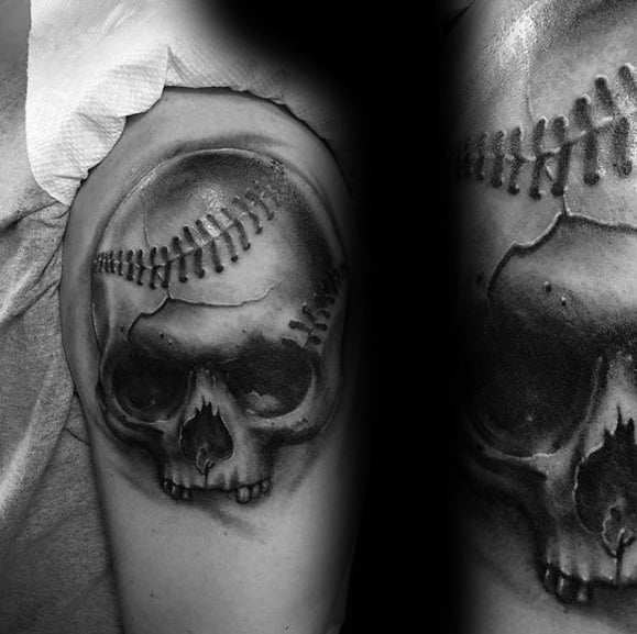 Black and grey tattoo of a skull merged with a baseball, featuring stitched seams across the top for a bold, edgy sports design.