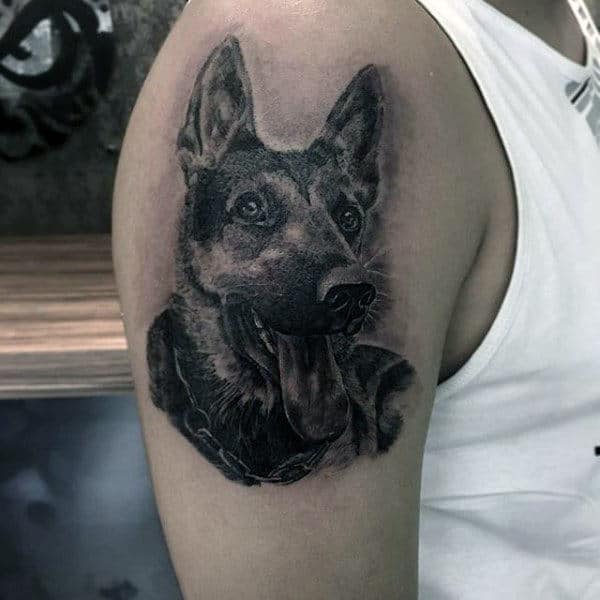 Gentleman With Upper Arm Tattoo Of Black Shaded Ink Dog Design