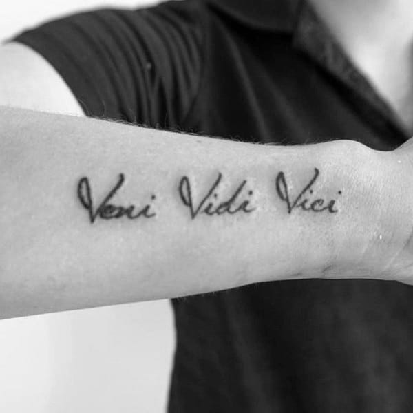 Gentleman With Veni Vidi Vici Tattoo On Wrist