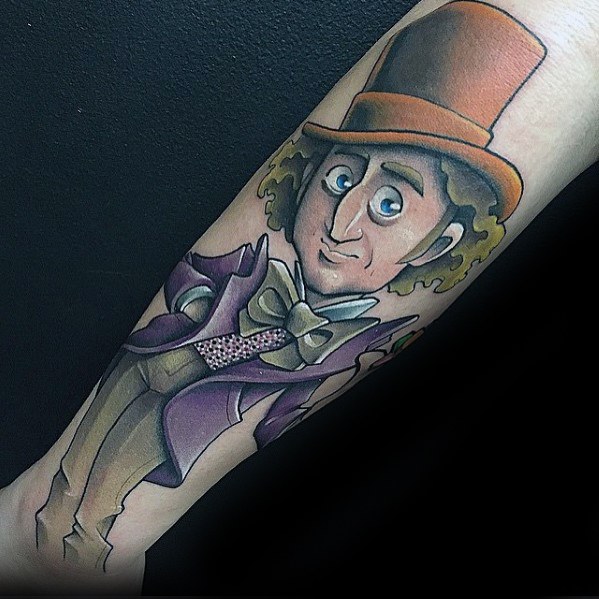 Cartoon-style Willy Wonka tattoo with exaggerated features, wearing a brown top hat, purple coat, and large bow tie.