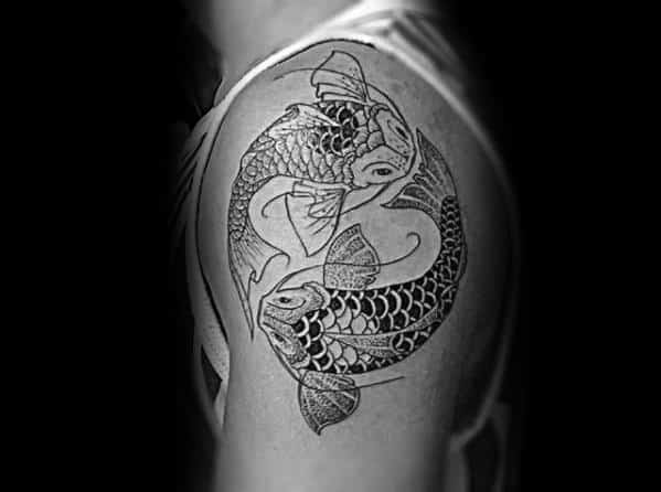 Gentleman With Yin Yang Koi Fish Tattoo On Upper Arm