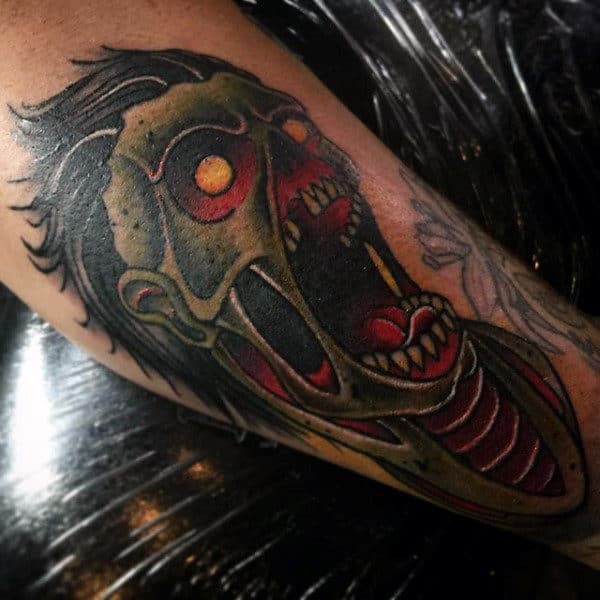 Gentleman With Zombie Face Tattoo On Arm
