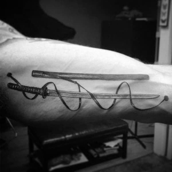 Gentlemen With Ninja Sword In Her Arm Tattoo