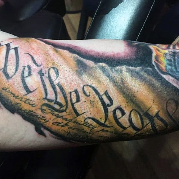 Gentlemen With We The People Tattoo On Arm