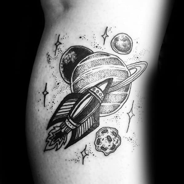 Blackwork Saturn tattoo design for men with a vintage rocket, stars, planets, and asteroid in a bold dotted style.