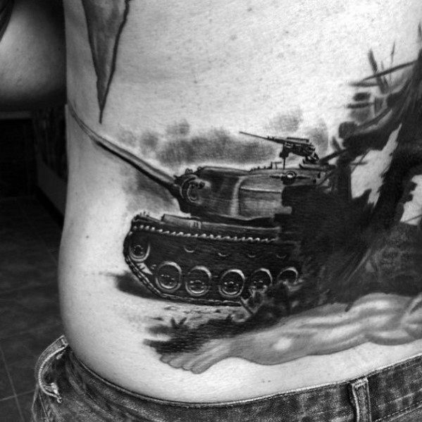 Realistic black and grey tank tattoo on the side torso, featuring smoke, motion, and dramatic battle scenery.