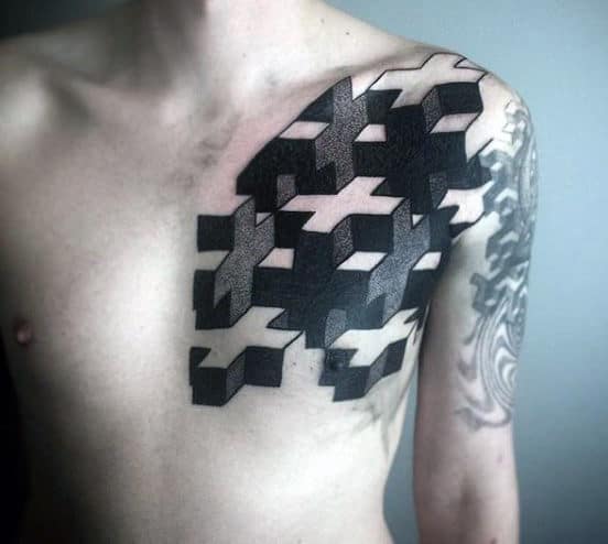Geometric black tattoos on a person's chest and shoulder, featuring interlocking 3D shapes and a swirling design on the arm