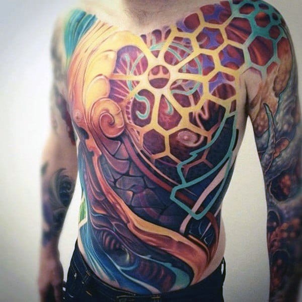 Vibrant biomechanical chest tattoo with hexagonal patterns and swirling colors, symbolizing fusion of nature, technology, and inner energy.