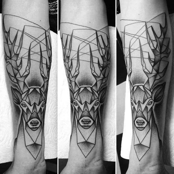 Large geometric deer tattoo on the forearm with sharp angular lines, abstract antlers, and symmetrical details for a striking modern look.