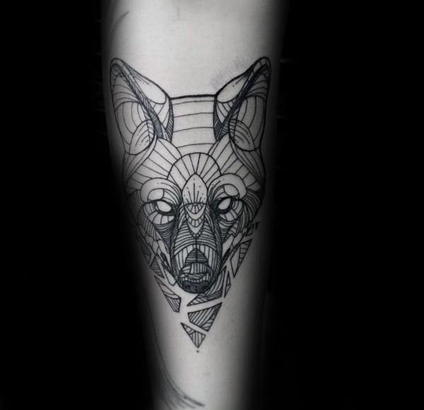 Intricate geometric wolf tattoo with detailed linework and symmetrical triangle patterns, positioned vertically on the forearm.