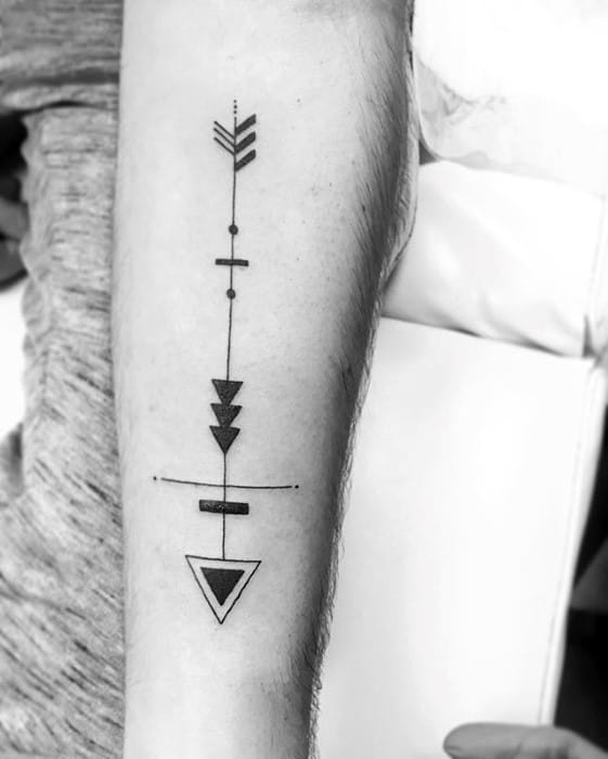 Geometric arrow tattoo with vertical alignment, triangle elements, and dot-line detailing in a clean, minimal forearm design.