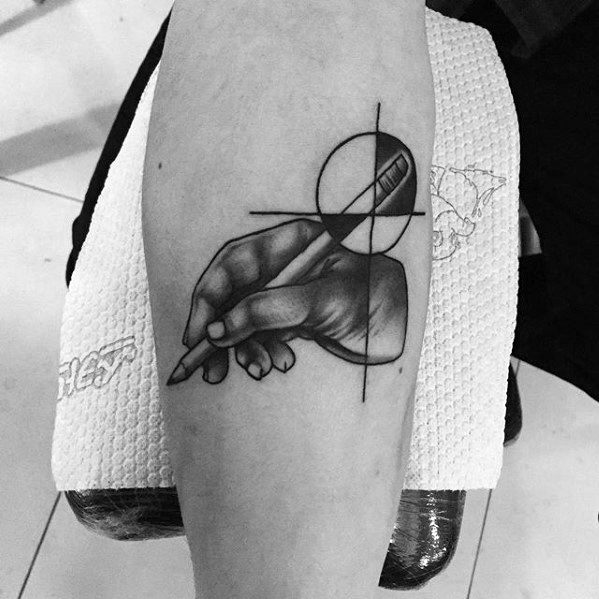 Black and gray tattoo of a hand gracefully gripping a pencil, elegantly intertwined with geometric lines on the arm