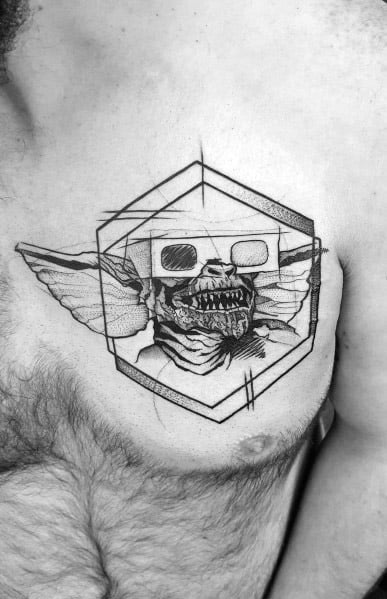 Sketch-style Gremlin tattoo with 3D glasses, geometric framing, and fine line details, blending realism with an artistic edge.