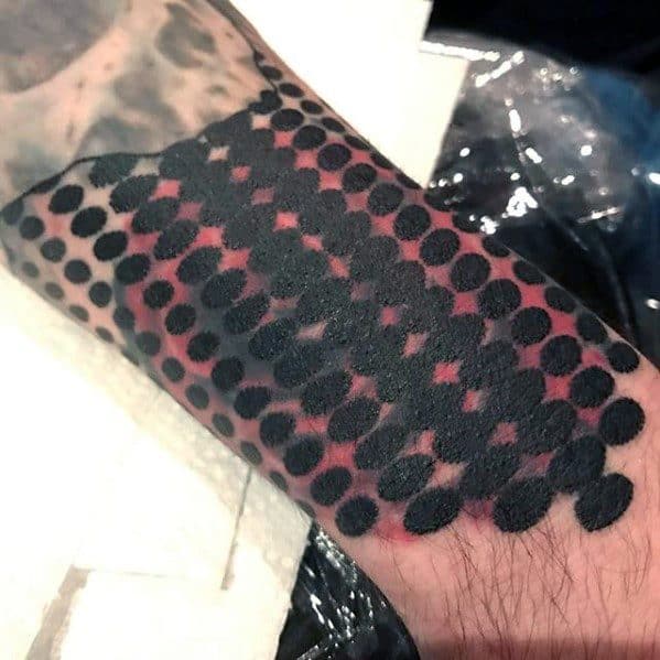 Blast over forearm tattoo with black dots and geometric pattern