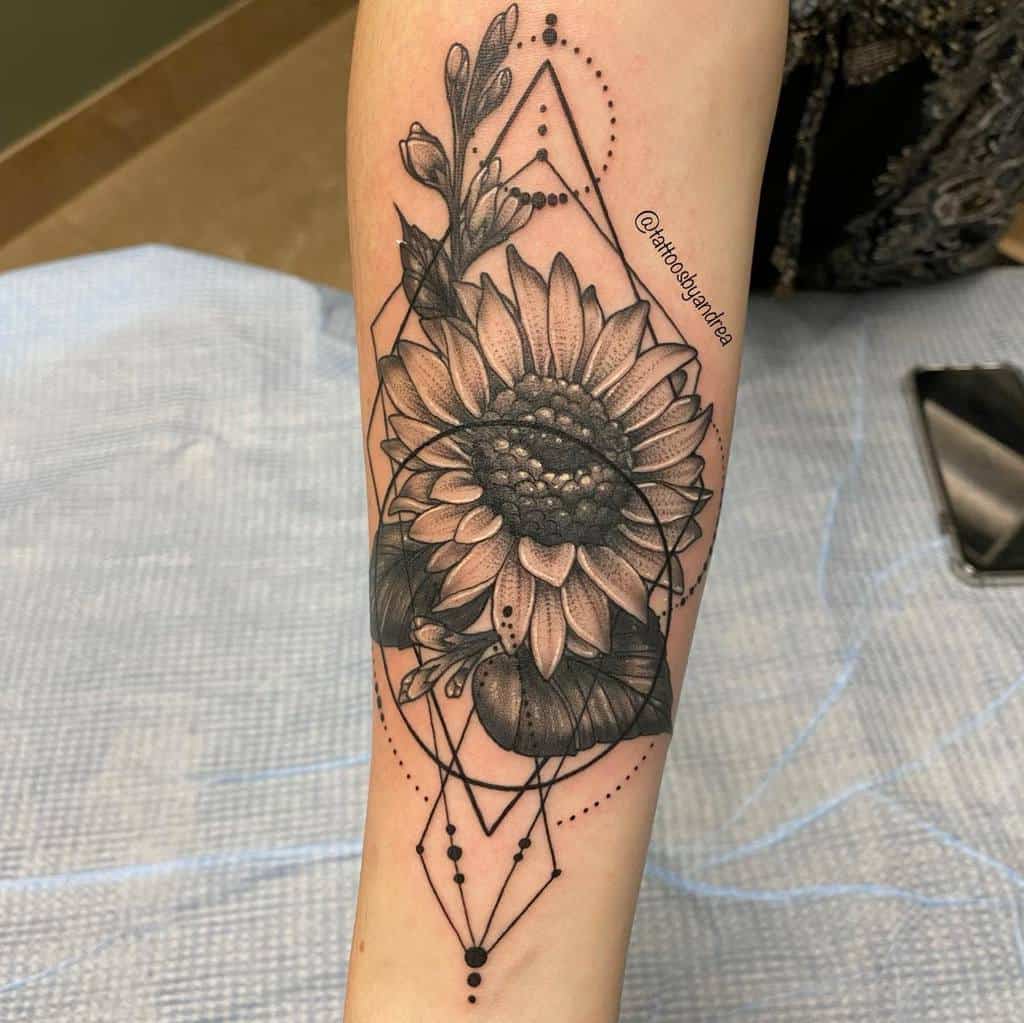 Forearm tattoo featuring a detailed sunflower with geometric shapes and dotwork accents