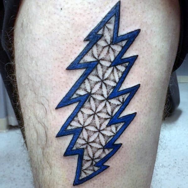 Grateful Dead lightning bolt tattoo outlined in blue with an intricate black geometric flower of life pattern inside.