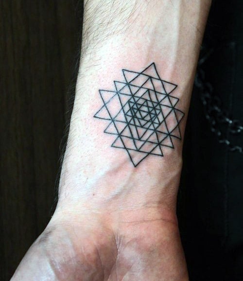 Geometric tattoo design on a wrist