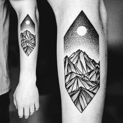 Bold blackwork tattoo of sharp geometric mountains under a stippled night sky and full moon inside a long diamond frame.