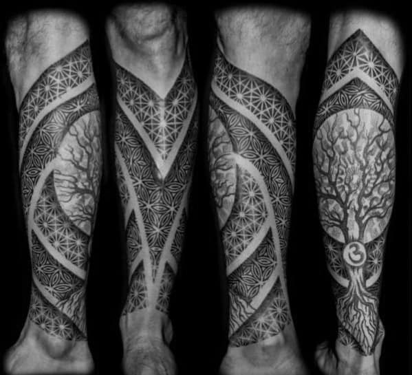Geometric and tree tattoo sleeve on the leg, featuring intricate patterns, bold lines, and a detailed tree with a symbolic design.