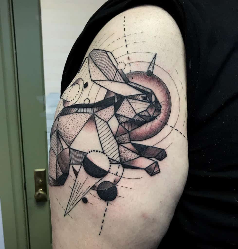 Geometric tattoo of a rabbit, made with sharp lines and angles, surrounded by abstract shapes and circles