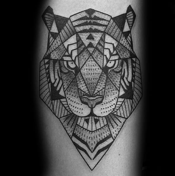 Detailed geometric tiger tattoo featuring symmetrical lines, dotwork shading, and bold triangular patterns for a striking visual effect.