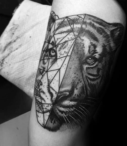 Tiger tattoo blending realistic shading on one half and geometric linework on the other, symbolizing duality and modern artistry.