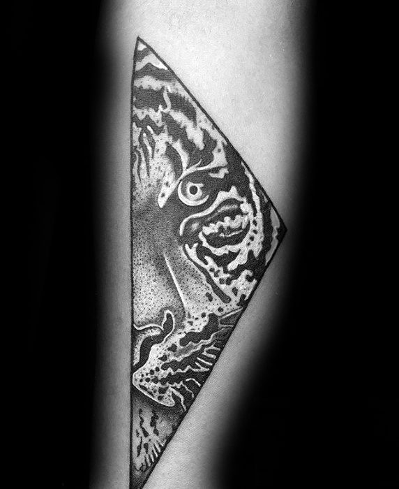 Abstract tiger tattoo inside a sharp diamond shape, combining dotwork shading and bold lines for a stylized, intense look.