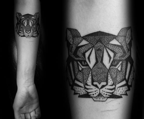 Geometric tiger tattoo on the forearm with bold black outlines and dotwork shading, creating a strong and symmetrical look.