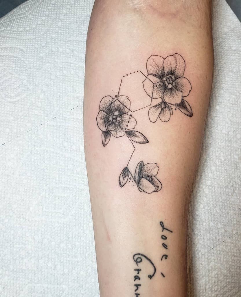 Fine-line dotwork tattoo of violet flowers connected by a geometric constellation design, symbolizing nature, harmony, and celestial beauty