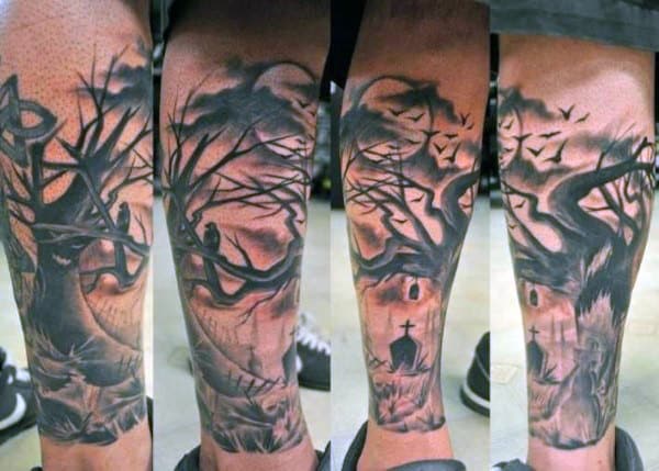 Leg tattoos of a dark forest with barren trees, bats, and a moonlit graveyard