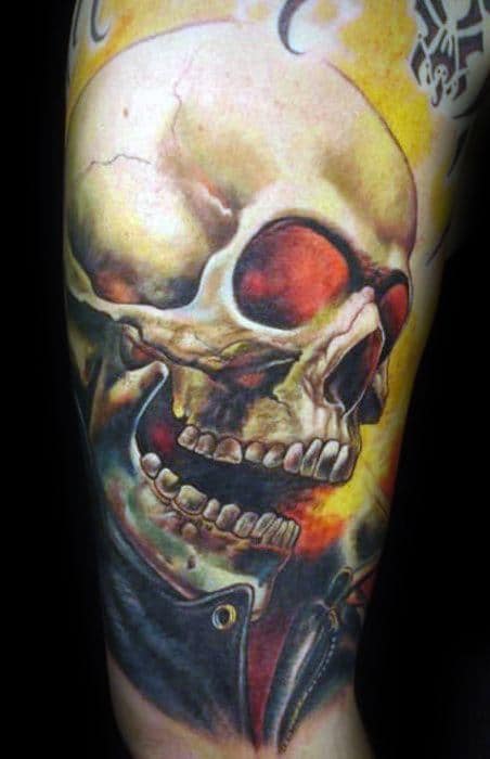 Vibrant Ghost Rider tattoo with a detailed flaming skull, glowing red eyes, and leather jacket on a fiery yellow-orange background.